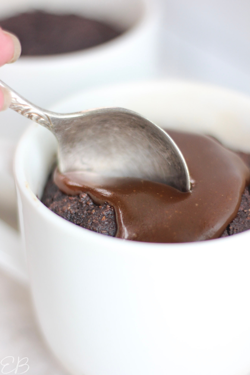 taking a spoonful out of the mug cake