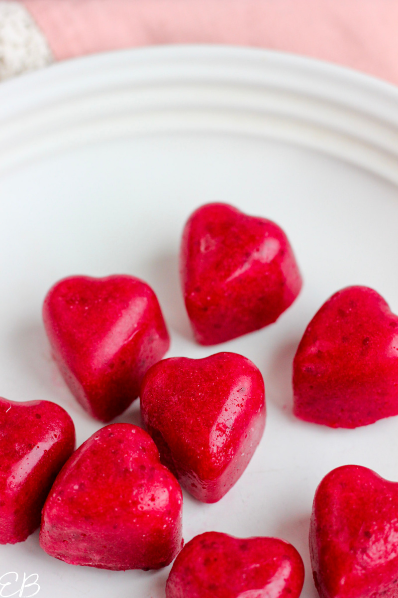 red heart gummies on white plate
