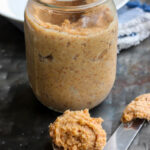 a jar and spoon of Fermented Almond Butter