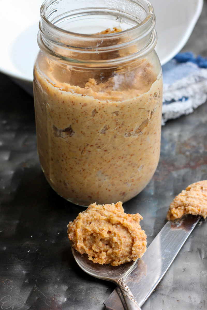 a jar and spoon of Fermented Almond Butter