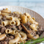 side angle view of paleo aip hamburger macaroni dished up in white bowl