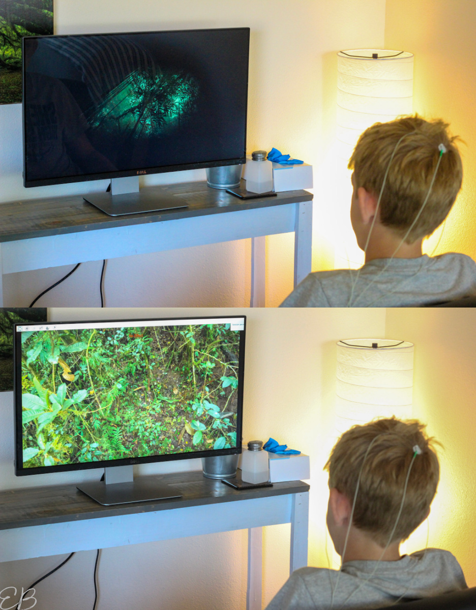 boy watching TV screen with changing neurofeedback images