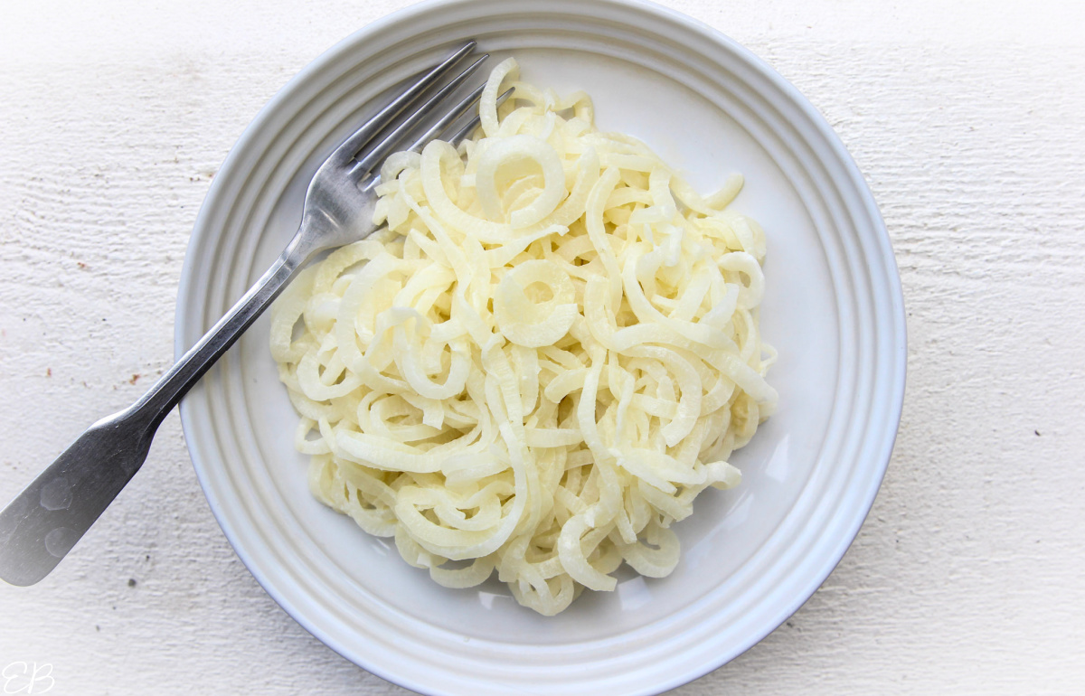 overhead view of daikon noodles on a white plate