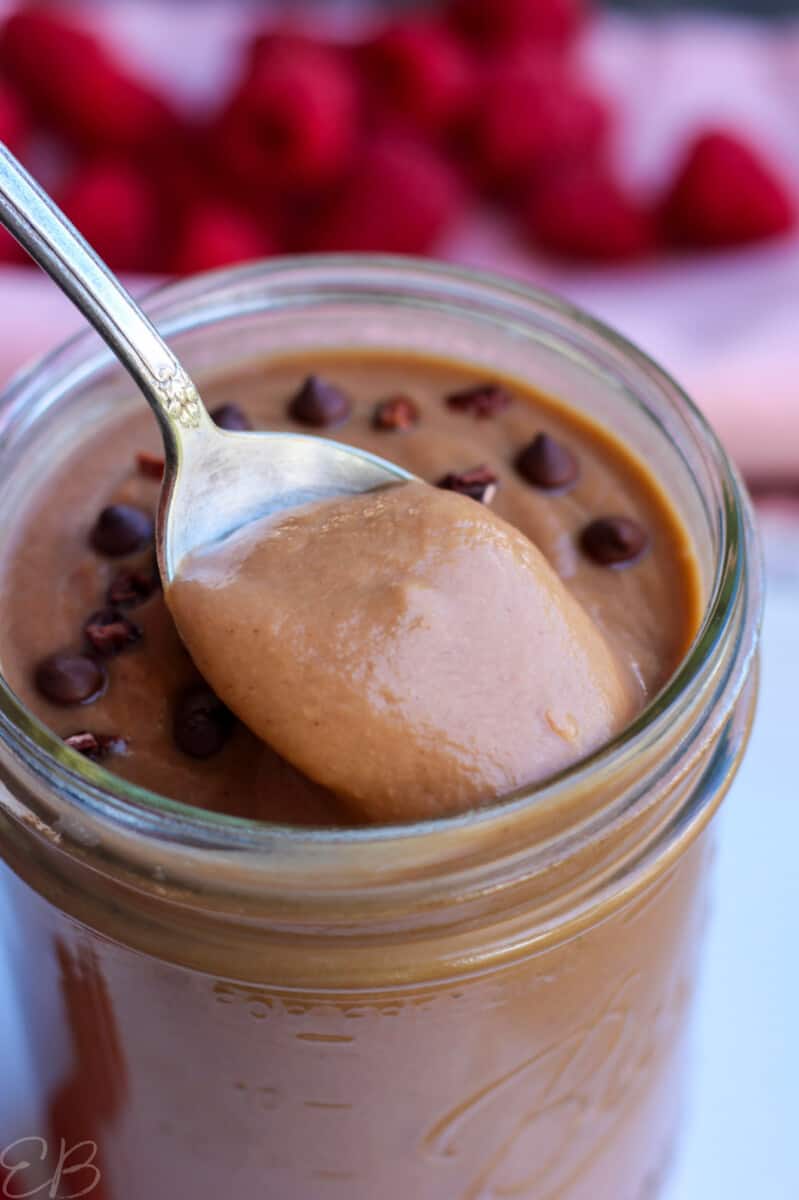 pulling a spoon out with warm or cold chocolate smoothie for weight loss on it