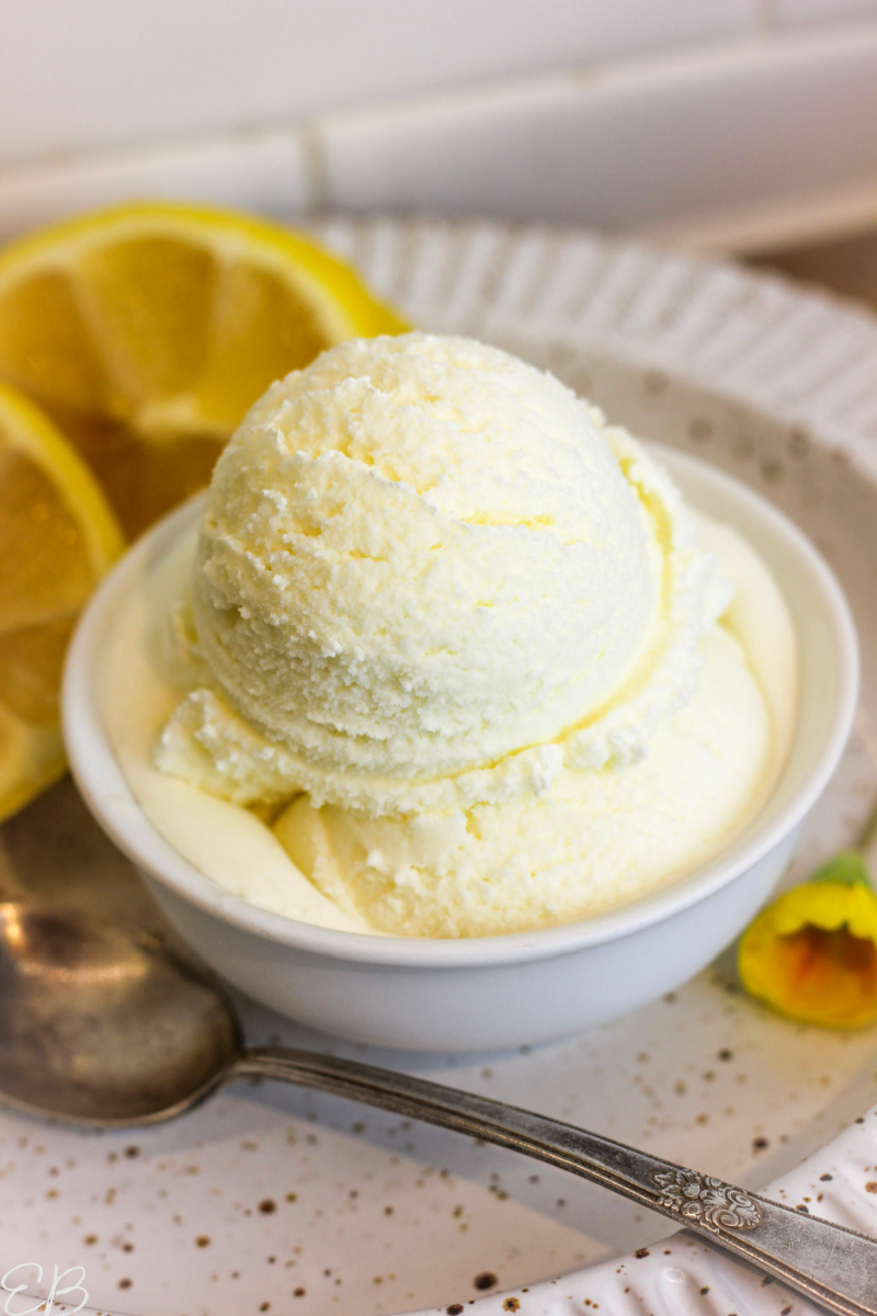 heaping scoops of lemon ice cream in white dish
