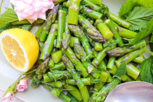 up close marinated asparagus salad on platter