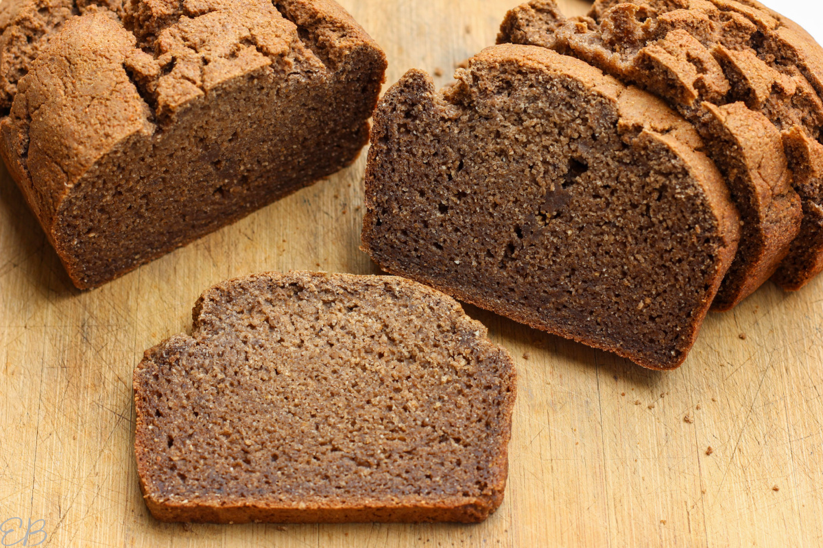 open slice of best easy aip bread recipe on cutting board