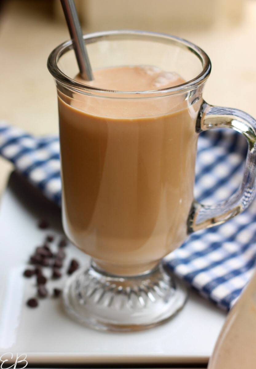 a glass of chocolate milk with straw