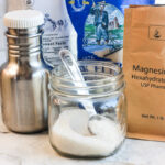 bulk homemade electrolyte powder in a jar with teaspoon