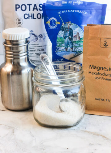 bulk homemade electrolyte powder in a jar with teaspoon