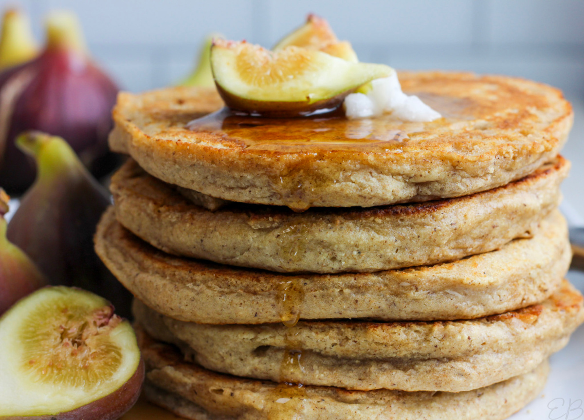 coconut oil, figs and maple syrup on stacked aip pancakes