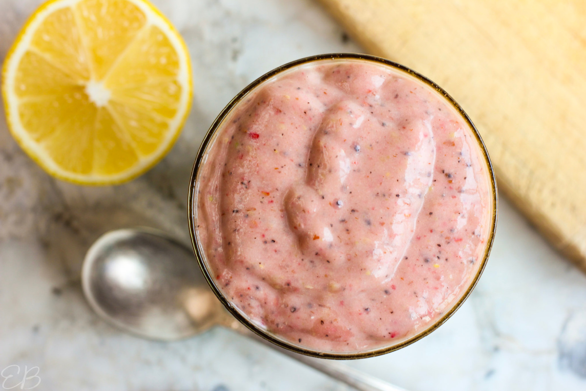 overhead view of keto smoothie for constipation in glass with lemon