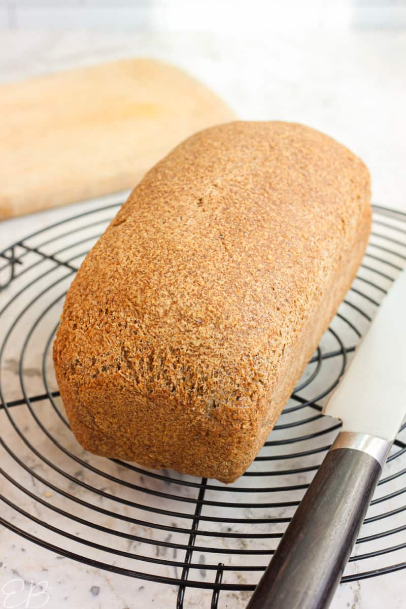 Sharing loaf of bread with saw stock photo