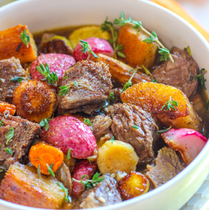 up close photo of middle eastern beef stew with za'atar in white bowl