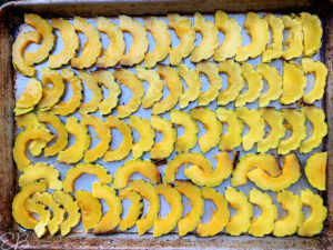 fanned out slices of squash ready to bake