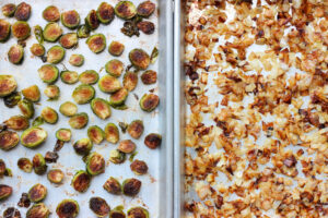 overhead view of roasted brussels sprouts and onions on sheet pans