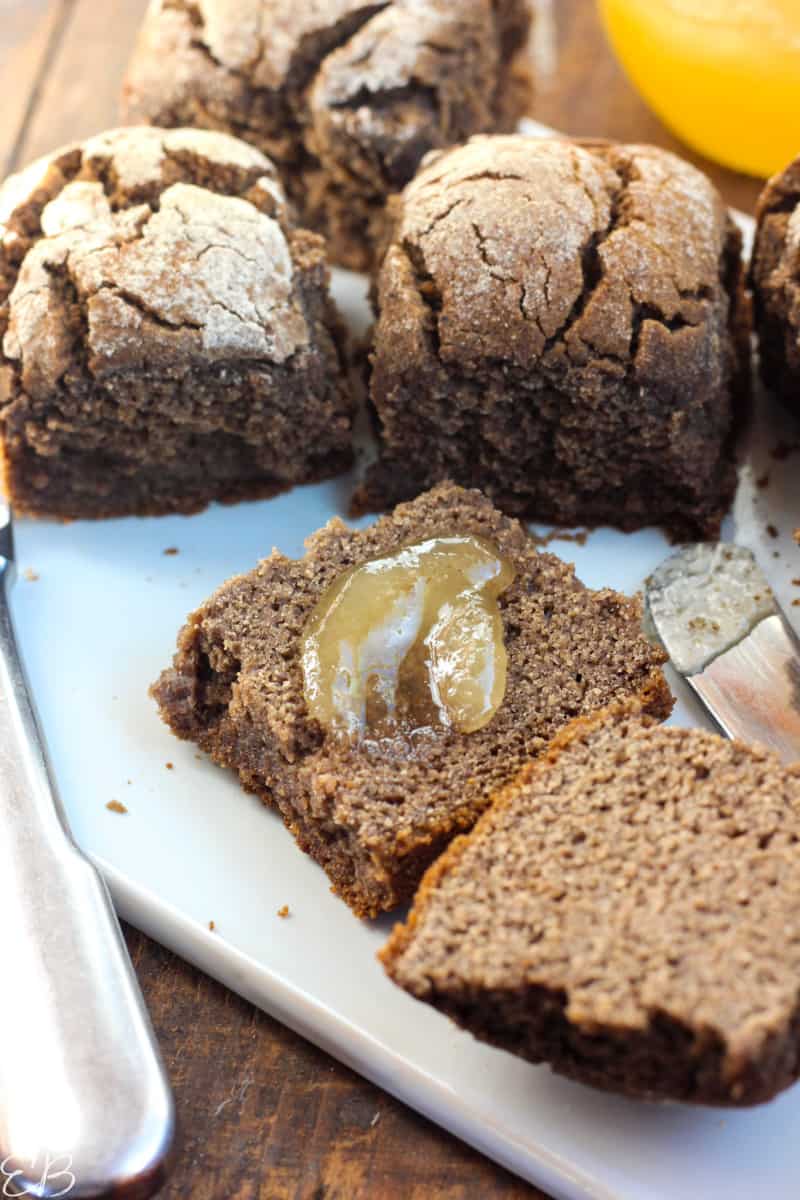 paleo aip bread rolls whole and one cut open with honey