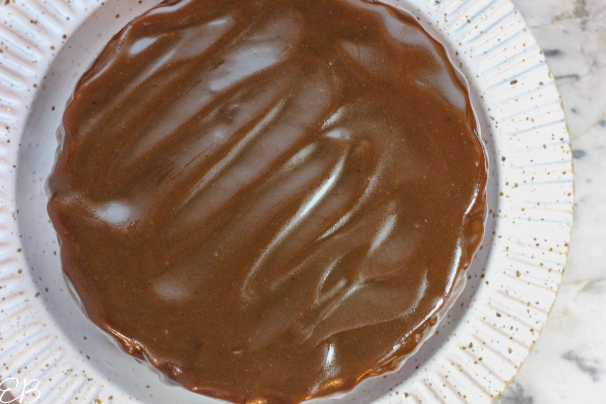 overhead view of the toffee caramel sauce spread on top of the cake