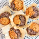 overhead view of 6 paleo aip beef & savory herb muffins on cooling rack