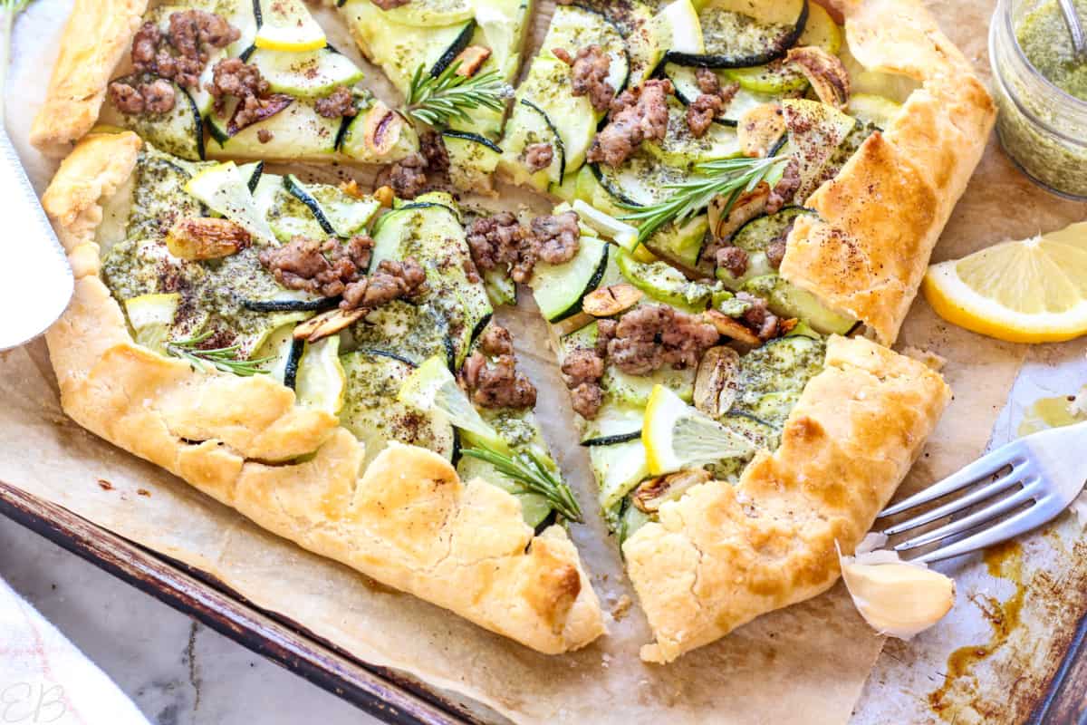 overhead view of zucchini galette with one slice being served