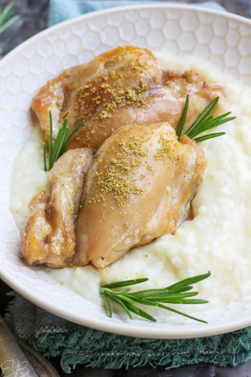 2 thighs of rosemary honey chicken served over cauli smash in white plate