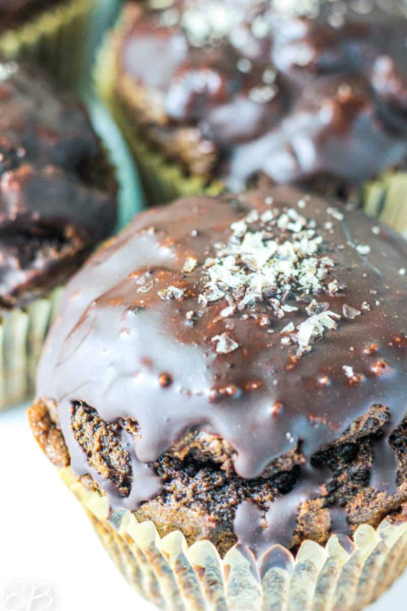 up close on ganache-glazed jumbo chocolate muffins