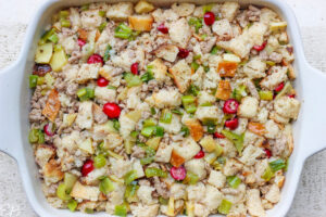 stuffing packed into casserole dish before baking