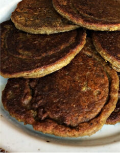 plain Cricket Flour Pancakes fanned on plate