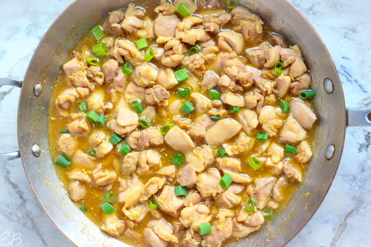 overhead view of honey ginger chicken in cooking pan
