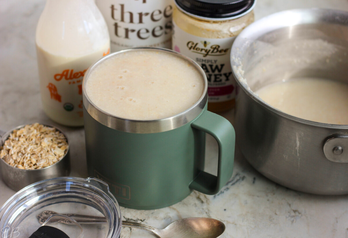 Drinkable Oatmeal Recipe in to-go mug with pot for cooking on possible stir-ins