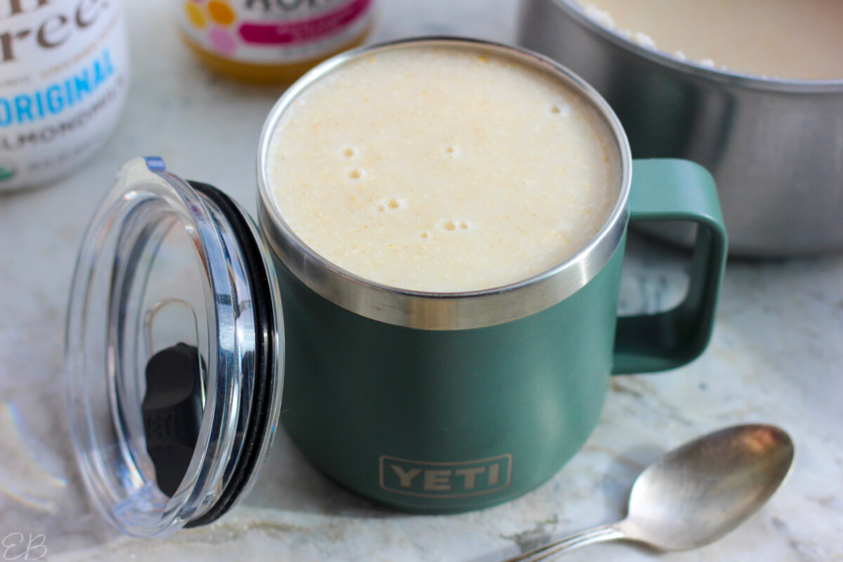 drinkable oatmeal poured into to-go mug