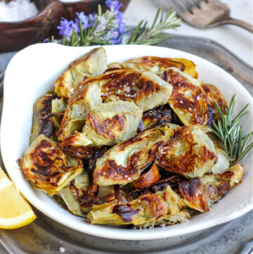 a delicious looking plate of roasted artichoke hearts