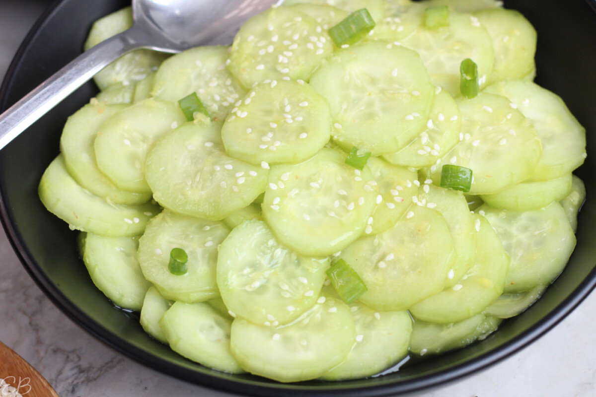 japanese cucumber salad with spoon in serving dish