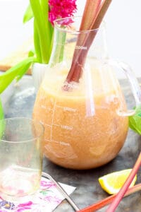 rhubarb lemonade in clear glass pitcher