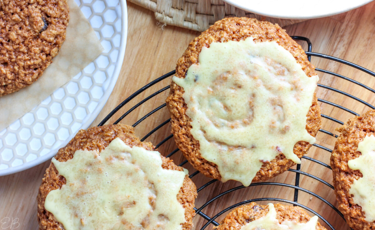 overhead view of gf vegan oatmeal cookies cooling on rack with glaze icing