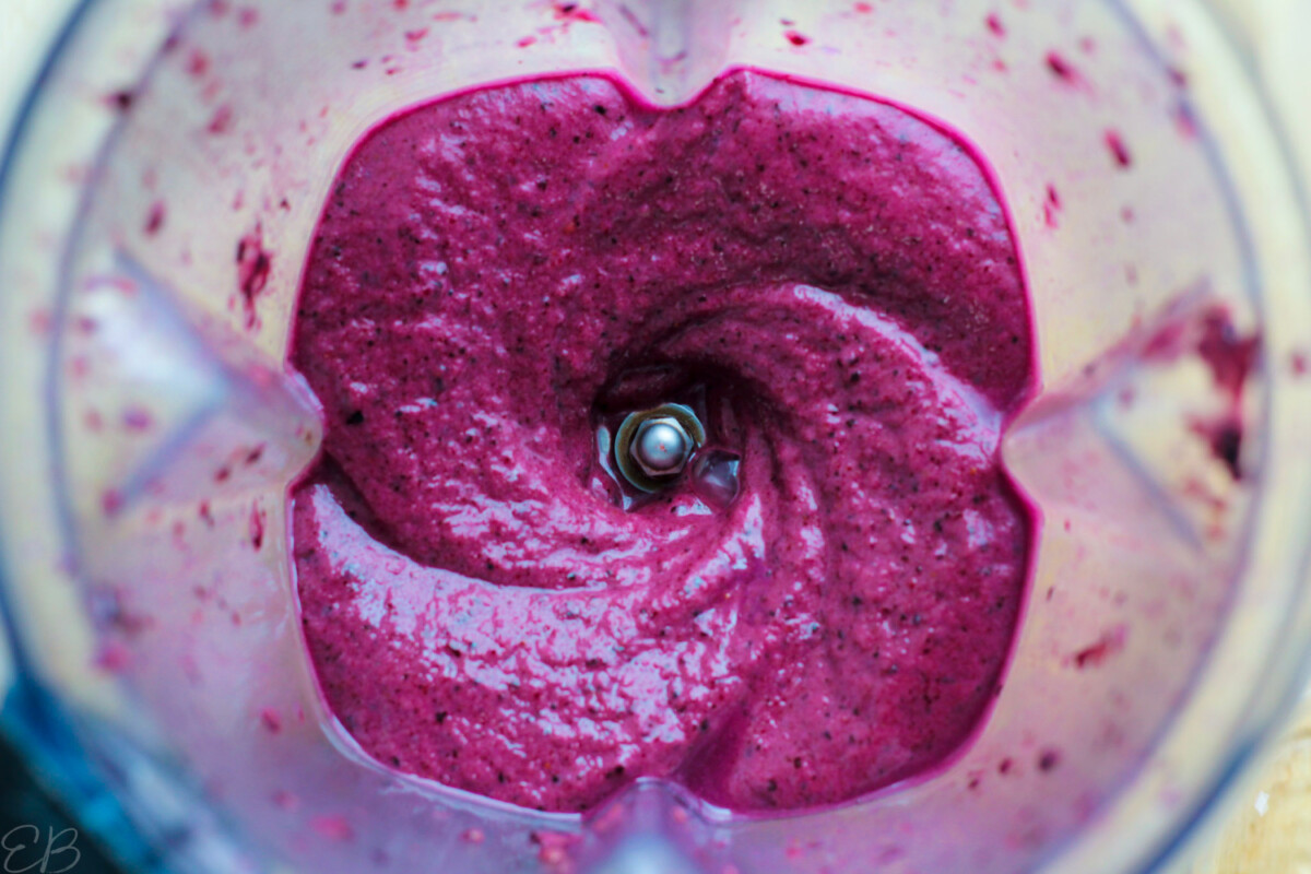 overhead view of blender after blending best blueberry smoothie showing amazing texture