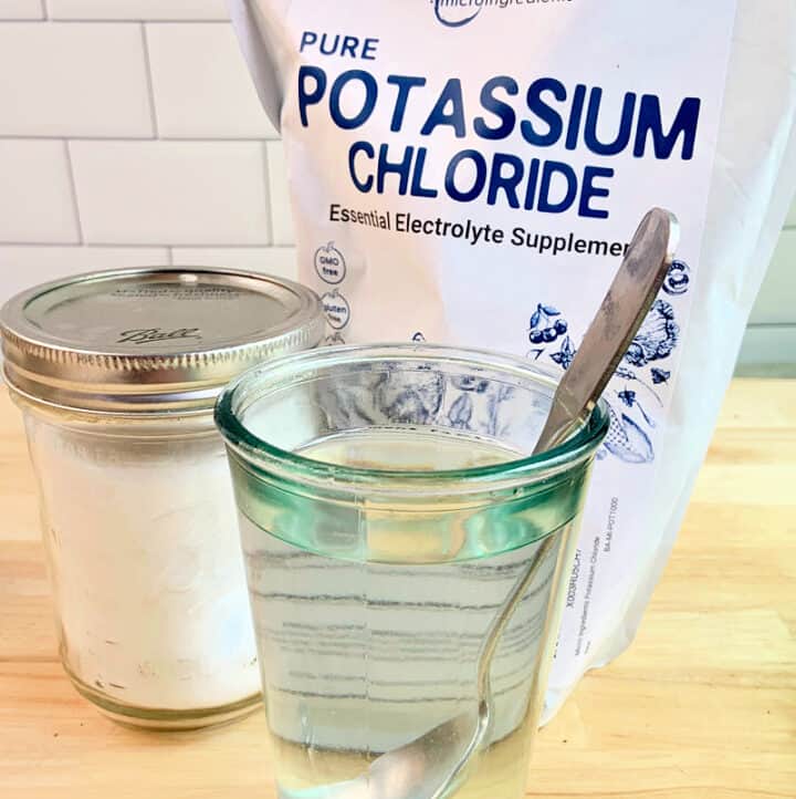 potassium chloride in a bulk bag, in a mason jar, and stirred into a glass of water to make Potassium Water