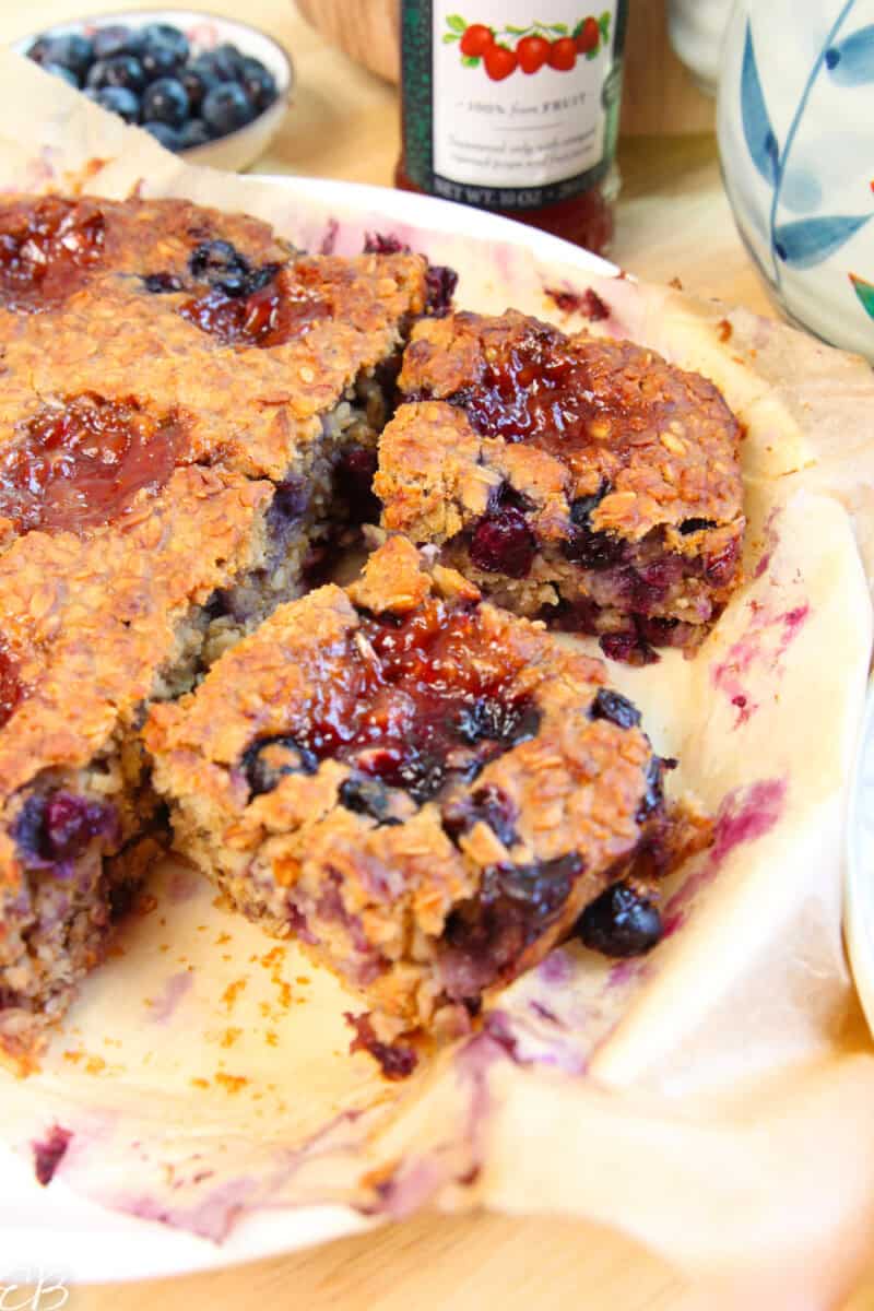 close up squares of baked peanut butter and jelly oatmeal ready to serve