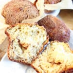 A gluten-free high protein cottage cheese muffin split open to see a cinnamon swirl inside