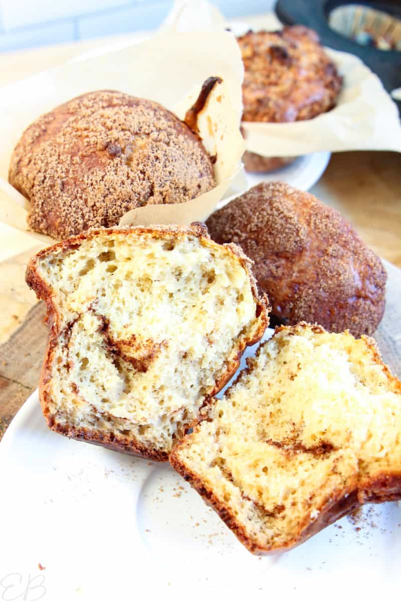 A gluten-free high protein cottage cheese muffin split open to see a cinnamon swirl inside