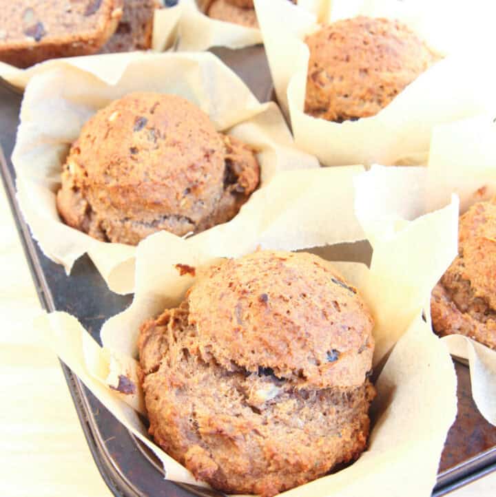 6 high calcium banana muffins in muffin pan, freshly baked and jumbo