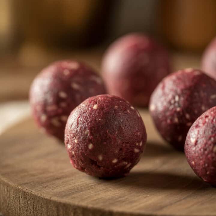 Raw Energy Balls with Diatomaceous Earth on wooden serving tray