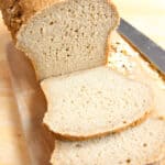 Sourdough Oat Flour Bread Loaf sliced thinly for sandwiches with view of soft fluffy interior