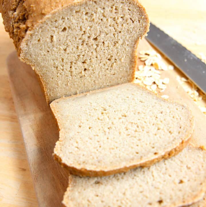 Sourdough Oat Flour Bread Loaf sliced thinly for sandwiches with view of soft fluffy interior