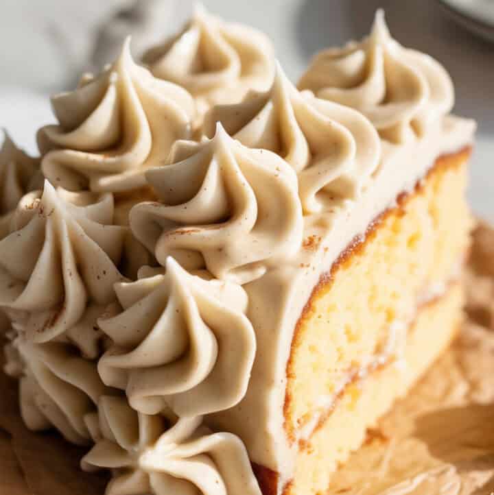 a big slice of cake piped beautifully with Paleo satin buttercream