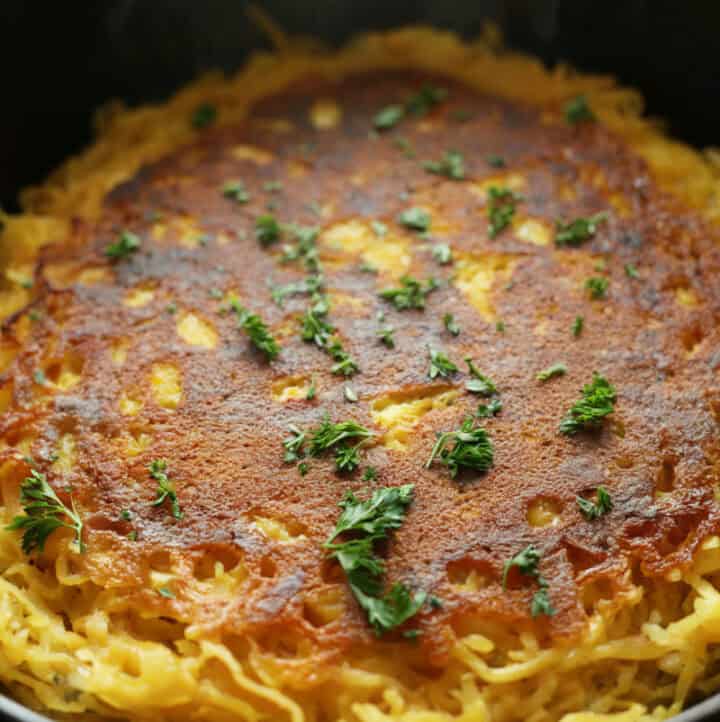UP CLOSE photo of spaghetti squash pancake just after cooking in pan