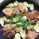 overhead lemon chicken artichoke dish in skillet