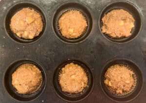 muffin batter in pan before baking