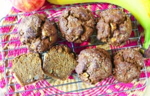 overhead view of apple banana muffins on cooling rack
