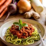 up close nomato marinara sauce with beets and carrots, served on zucchini noodles